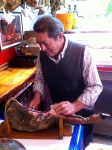 Ronda ham cutter expertly slices his jamon